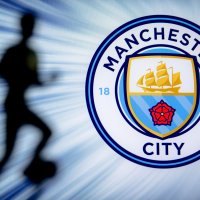 Manchester City Football club logo next to a shadow graphic of a sportsman in action