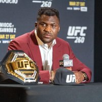 Francis Ngannou speaking at a press conference after winning his heavyweight title in 2021