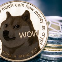 The dogecoin logo on a silver coin