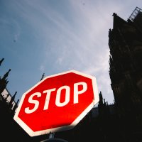 A stop sign in front of Dom Cathedral, Cologne, Germany