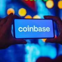 Coinbase logo displayed on a smartphone screen