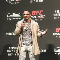 MMA fighter Kevin Lee taking questions at a weigh-in 