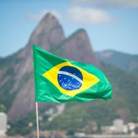 The Brazilian flag flying on Ipanema Beach in Rio de Janeiro