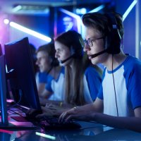 Team of teenage gamers taking part in esport tournament
