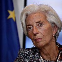 Christine Lagarde, president of the European Central Bank, pictured next to an EU flag