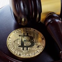  BTC crypto coin and gavel on a desk