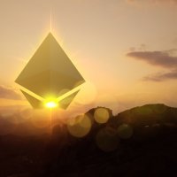 Ethereum symbol in the sky as the sun rises over mountains