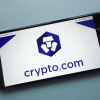 A smartphone showing the crypto.com logo