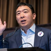 Andrew Yang speaking at a convention