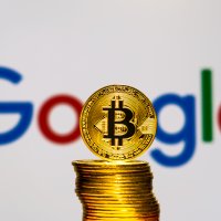 Bitcoins with the Google logo in background