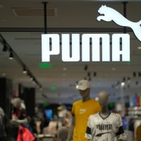 PUMA's shop sign hanging in store