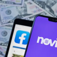 Novi logo and facebook app on smartphones in front of US currency