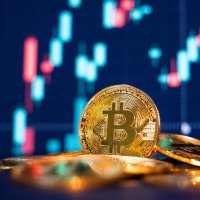 Bitcoin (BTC) coins against a chart backdrop