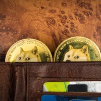 Two Dogecoins, featuring a Shiba Inu dog, inside a wallet