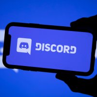 View of name and logo of app Discord on a mobile phone