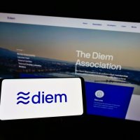Smartphone displaying the Diem company name and logo in front of its website page