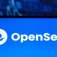 The OpenSea logo as displayed on a smartphone