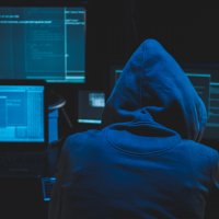 A hacker stealing crypto cash