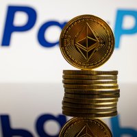 Stack of ether coins foregrounding PayPal logo – Photo: Shutterstock