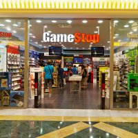 GameStop shop with customers visible through large windows