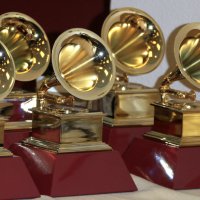 A set of GRAMMY Award statues grouped together on a table