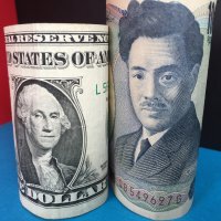 US dollar and Japanese yen banknotes representing exchange rate