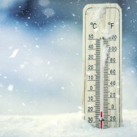Thermometer in snow, showing minus temperatures