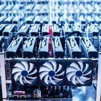 Bitcoin mining farm with banks of computers and cooling equipment