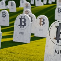 Graphic representing a cemetery full of headstones bearing the Bitcoin logo and the letters RIP