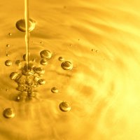 Liquid gold pouring into a vessel