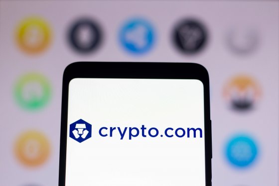 Logo and name of cryptocurrency exchange Crypto.com displayed on a smartphone