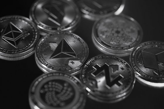 A range of altcoin tokens on a black background