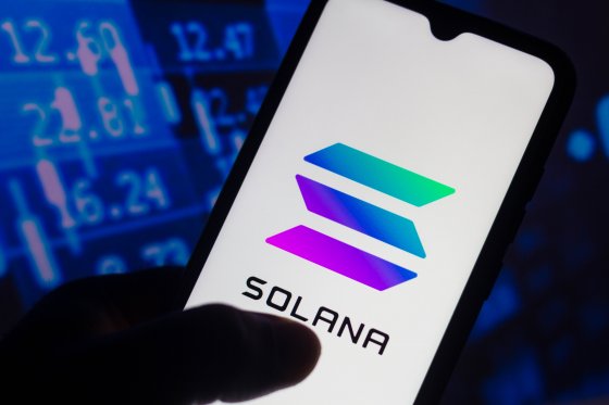 A smartphone displays the Solana name and icon