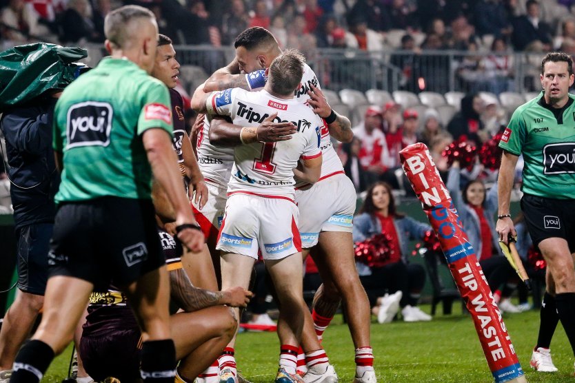 St George Illawarra Dragons players celebrate scoring a try