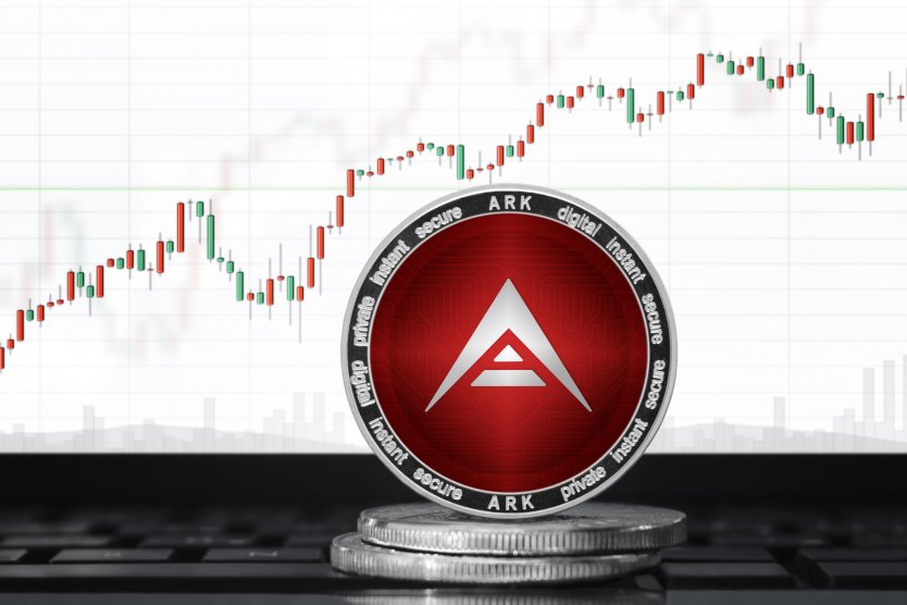 The Ark logo appears on a coin in front of a candlestick price chart