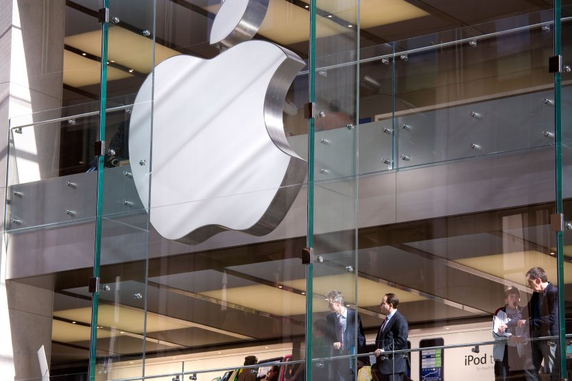 Apple store in Sydney, Australia with company logo displayed through glass shop front
