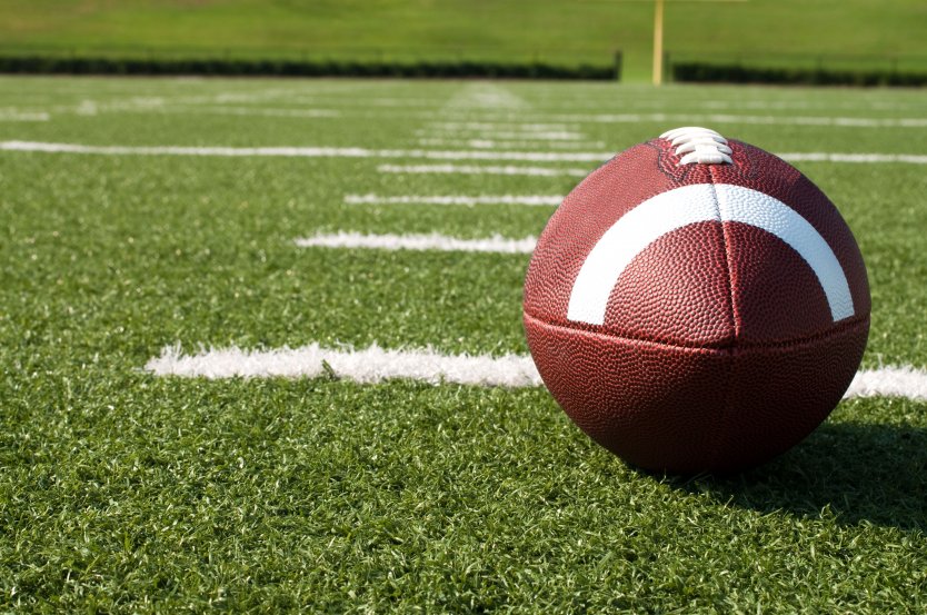 Closeup of American football on the field