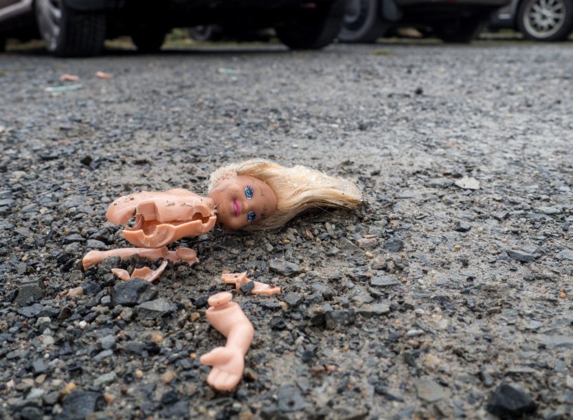 A broken Barbie doll