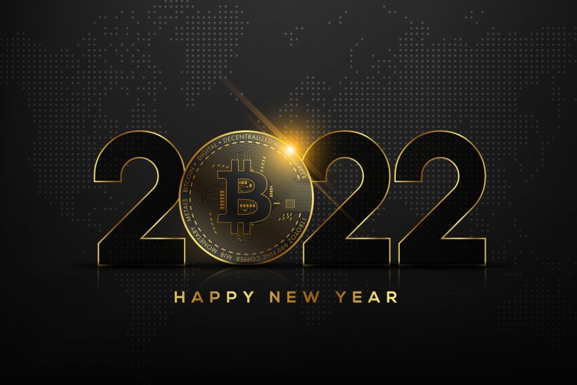 In front of a world map, the text '2022' is written with the '0' replaced with the bitcoin logo. 