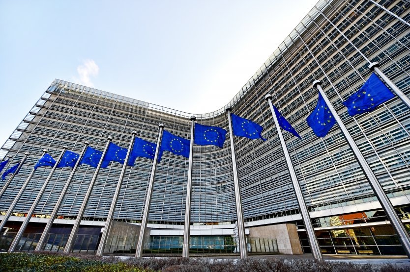 EU flags in front of the European Commission headquarters in Brussels