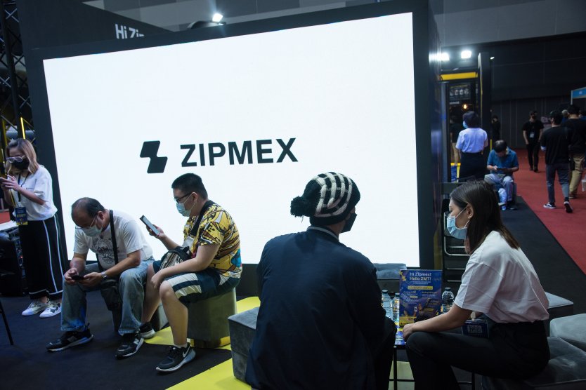 Visitors seen visiting a Zipmex stand at an exhibition