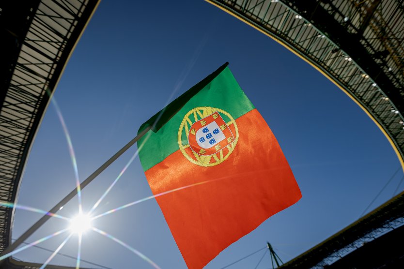 The flag of Portugal surrounded by a blue sky flies at the Estadio Jose Alvalade 