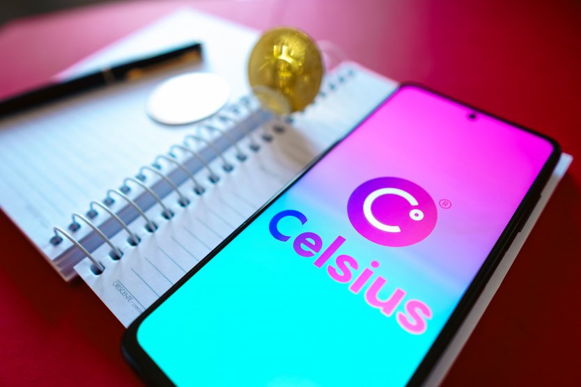 In this photo illustration, the Celsius Network logo is displayed on a smartphone screen beside Bitcoin cryptocurrencies
