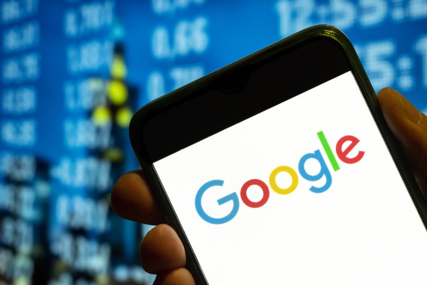In this photo illustration, the US multinational technology company and search engine Google logo is displayed on a smartphone screen 