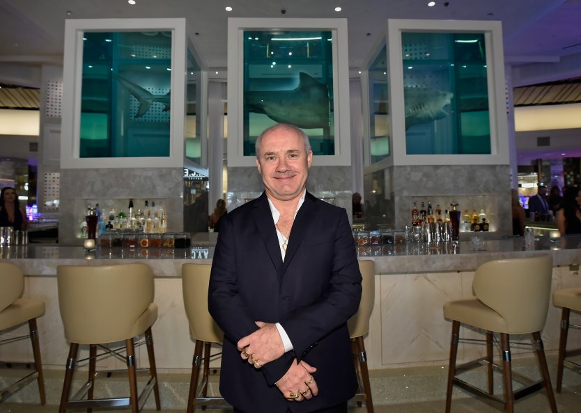 Artist Damien Hirst standing in front of his famous shark artwork at the Palms Casino Resort, Las Vegas, 2018