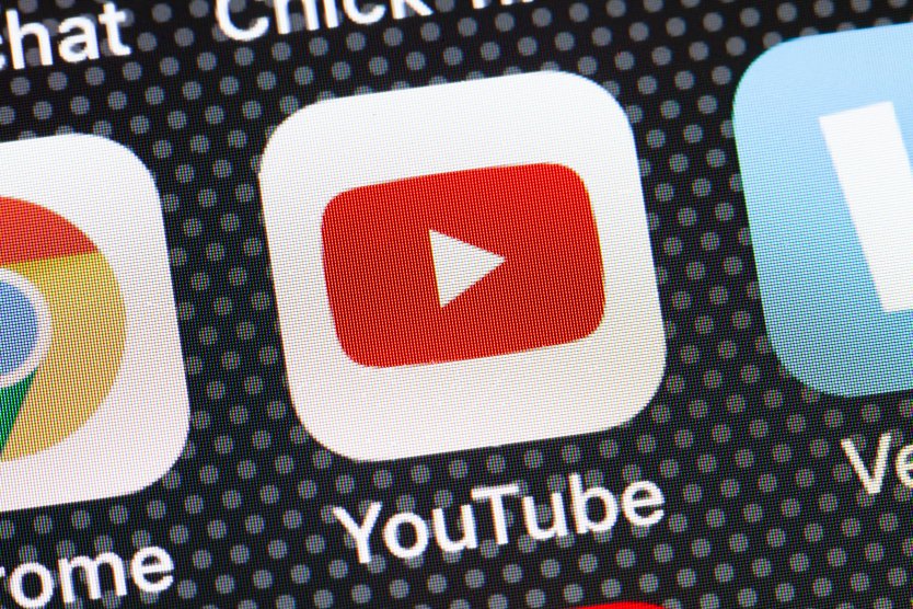 YouTube app icon on iPhone screen