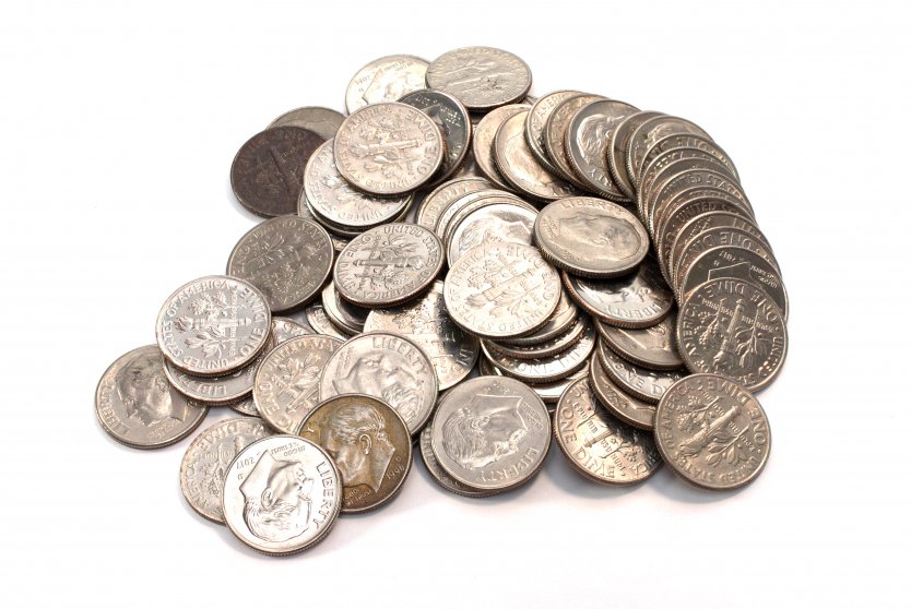 Pile of dimes on white background – Photo: Shutterstock