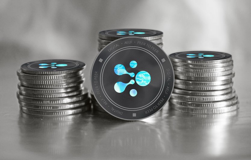 Stacks of ELF coins against grey background – Photo: Shutterstock
