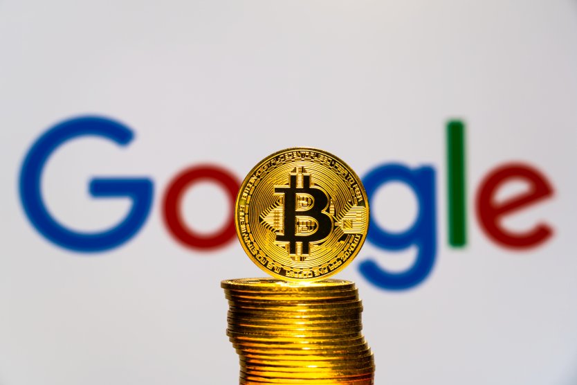 Bitcoins with the Google logo in background