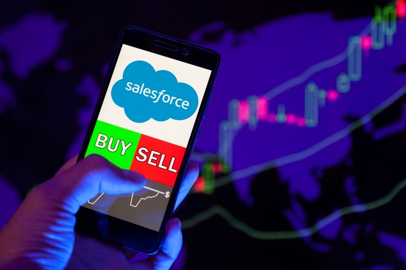Salesforce logo on smartphone with 'buy' and 'sell' buttons